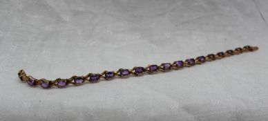 An amethyst set tennis bracelet,