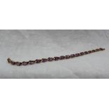 An amethyst set tennis bracelet,