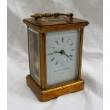 A brass cased carriage clock the enamel dial with Roman numerals inscribed Matthew Norman, London,