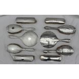 A George V silver part dressing table set, comprising a hand mirror,