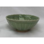 A green Celadon bowl, with a wave edge and ribbed bowl, 13cm diameter,