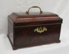 A George III mahogany tea caddy, of rectangular form, with a brass carrying handle and domed top,