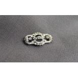 An Art Deco Diamond brooch, set with cushion,