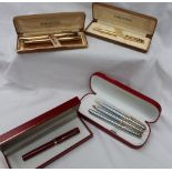 A Sheaffer Targa electroplated gold fountain pen together with a matching ballpoint,