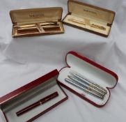 A Sheaffer Targa electroplated gold fountain pen together with a matching ballpoint,