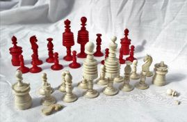 A 19th century bone barleycorn part chess set, natural and stained red, King 9cm high,