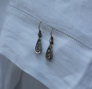 A pair of Diamond drop earrings,