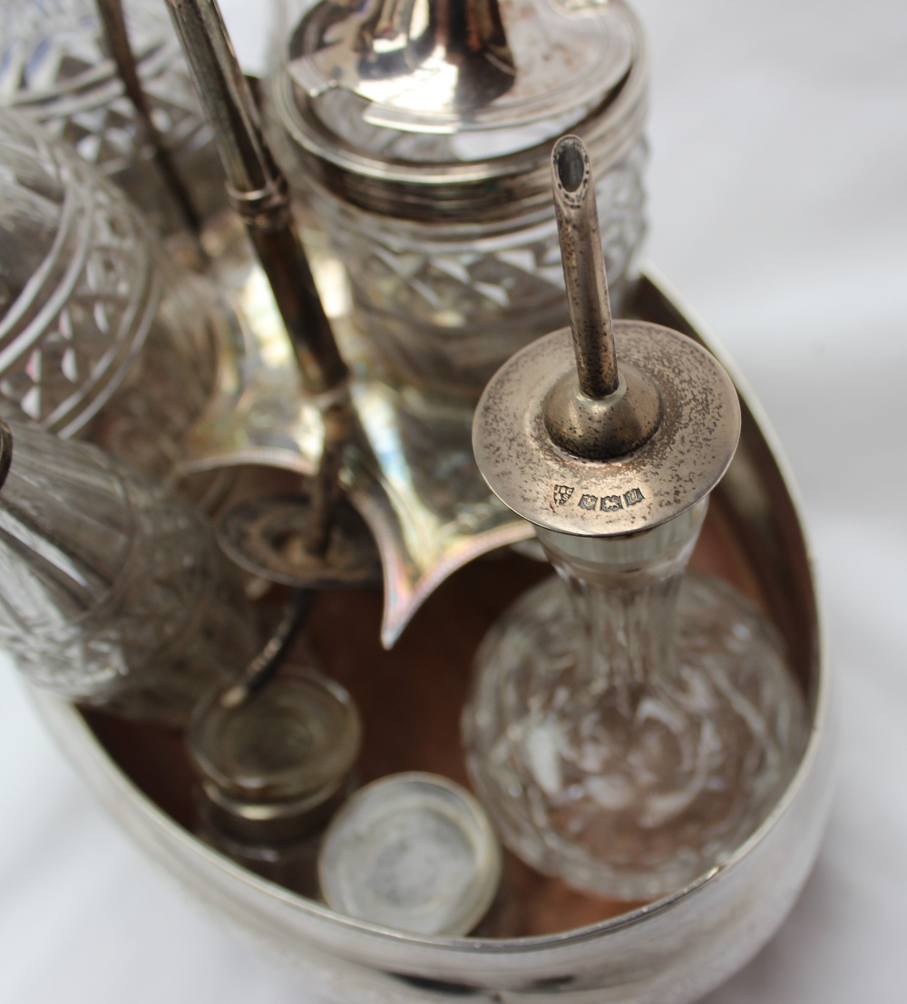 A George III silver cruet stand, of pointed oval form, with decorative roundels, on four feet, - Image 4 of 4