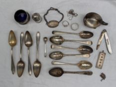 A set of four George V silver tea spoons, Sheffield, 1935 together with assorted silver spoons,
