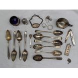 A set of four George V silver tea spoons, Sheffield, 1935 together with assorted silver spoons,