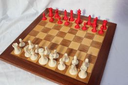 A Staunton pattern ivory chess set by Jaques & Son, the white king stamped `JAQUES LONDON`,