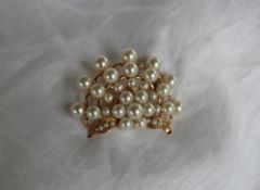 A pearl set brooch,