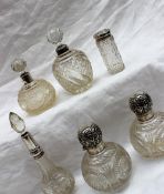 A pair of late Victorian silver topped and cut glass scent bottles, London, 1899,