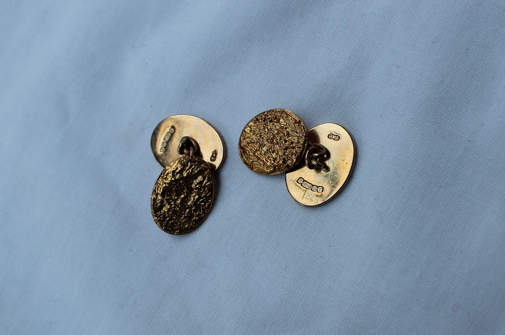 A pair of 9ct yellow gold oval cufflinks,