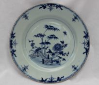 A Chinese porcelain plate, painted to the centre with a fence pattern,