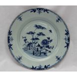 A Chinese porcelain plate, painted to the centre with a fence pattern,