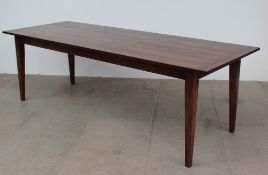 A 20th century oak refectory table with a rectangular planked top on four square tapering legs,