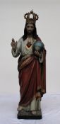 A carved pine polychrome decorated figure of Jesus Christ, wearing a crown,