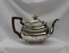 A George III silver teapot, of oval form with partial reeding, London, 1789 or 1809,