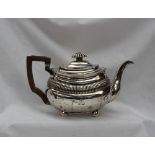 A George III silver teapot, of oval form with partial reeding, London, 1789 or 1809,