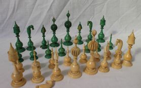 A 19th century Anglo Indian carved ivory chess set, natural and stained green,