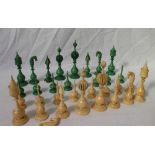 A 19th century Anglo Indian carved ivory chess set, natural and stained green,