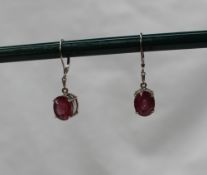 A pair of 18ct white gold and ruby drop earrings,