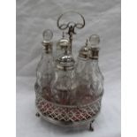 A early George III silver cruet stand, with a leaf hoop handle,