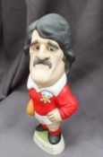 A resin Grogg of Gerald Davies, in a red Wales Jersey with Number 14 on the reverse,