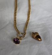 A 9ct yellow gold double albert watch chain with a fob seal and an 9ct yellow gold acorn pendant,