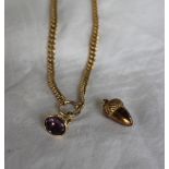 A 9ct yellow gold double albert watch chain with a fob seal and an 9ct yellow gold acorn pendant,