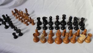 A Staunton boxwood and ebonised weighted chess set, the rooks marked with a red crown,