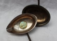 A white metal toddy ladle,