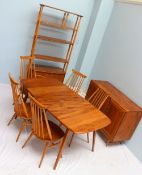 An Ercol dining room suite, comprising an extending dining table with hinged leaf,