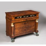 AN EMPIRE CHEST / Around 1815, northern Germany A chest with two high and two low drawers. Along the