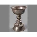 AN 18TH/19TH CENTURY SINO-TIBETAN SILVER STANDING ALTAR CUP, the upper-section of bowl form engraved