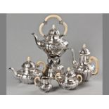 A FIVE PIECE .800 STD GERMAN SILVER TEA AND COFFEE SET, E.D. WOLLENWEBER, comprising a kettle-on-