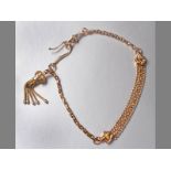 A 9CT YELLOW GOLD ALBERTINA, with tussle and dog clasp, 25cm long, 10.9g.
