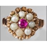 A 9ct YELLOW GOLD, PEARL AND RED STONE RING, the claw setting centre red stone surrounded by seven