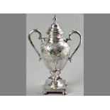 A SILVERPLATE TEA URN, removable lid with finial, C-form handles, body pinprick engraved with