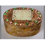 A LATE 19TH/EARLY 20TH CENTURY SINO-TIBETAN OVAL GILDED COSMETIC BOX, the body decorated with