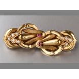 AN 18CT YELLOW GOLD, SEED PEARLS AND RUBY BROOCH, two claw-set rubies on scroll form and seed pearls