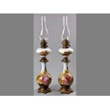 AN ATTRACTIVE PAIR OF CONTINENTAL OPALINE BRASS MOUNTED OIL LAMPS, CIRCA 1860, the lower bulbous