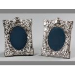 A PAIR OF 20TH CENTURY SILVER PHOTOGRAPH FRAMES, SHEFFIELD 1982, R.C., embossed with putti, scrolls,
