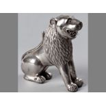 AN AMUSING 19TH CENTURY SILVER MODEL OF A LION, probably Indian, the mane finely worked, filled,