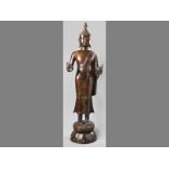 A LATE 20TH CENTURY LARGE THAI BRONZE STANDING FIGURE OF THE BUDDHA SAKYAMUNI, on a double lotus