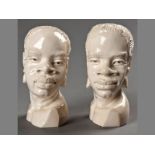 A PAIR OF AFRICAN CARVED IVORY BUSTS, bases signed "Titus Mugari", 16cm & 15cm high, (2).