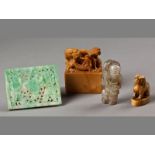 A GROUP OF CHINESE CARVINGS, comprising; a square green jade plaque of two boys with a lotus, 6 by