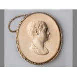 A 19CT YELLOW GOLD CERAMIC CAMEO BROOCH, of a gentleman in high relief in an oval rope form