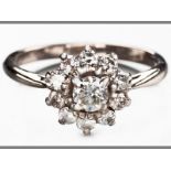 AN 18CT WHITE GOLD AND DIAMOND RING, centre claw set brilliant cut diamonds, diamonds of